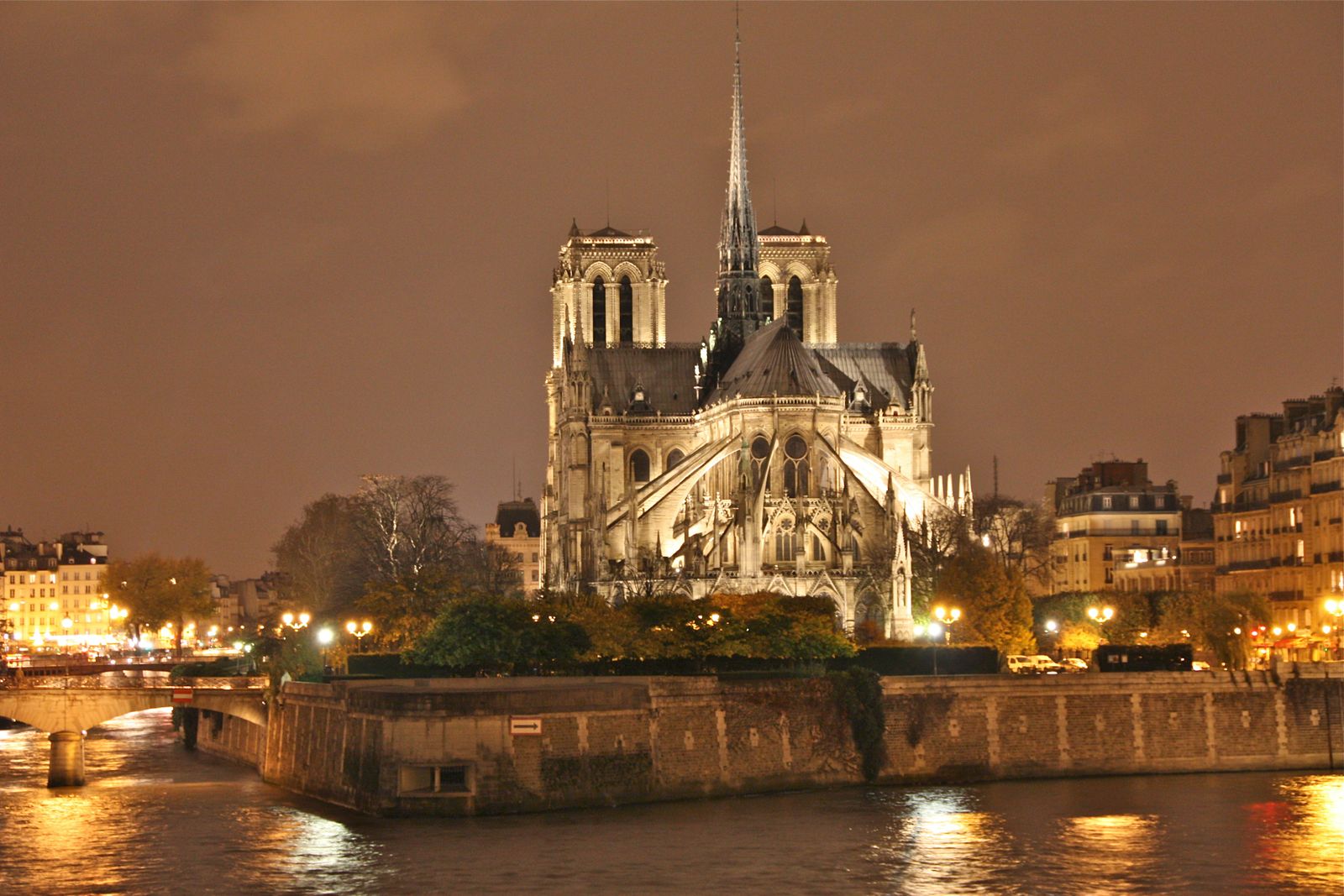 Notre-Dame de Paris lit at night above the Seine