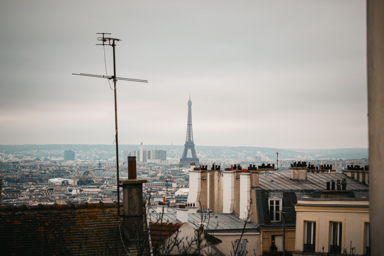 Paris rooftops in winter, with the Eiffel Tower in the distance