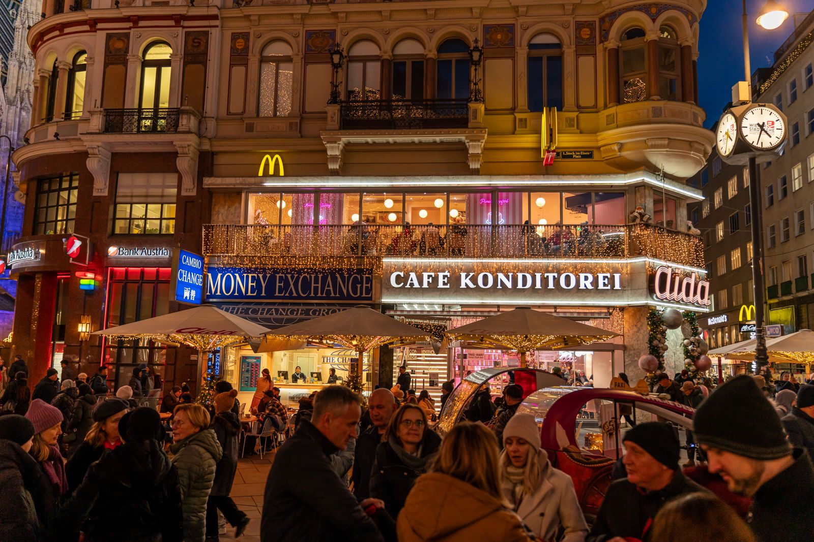 A Viennese café and pastry shop on a busy winter evening