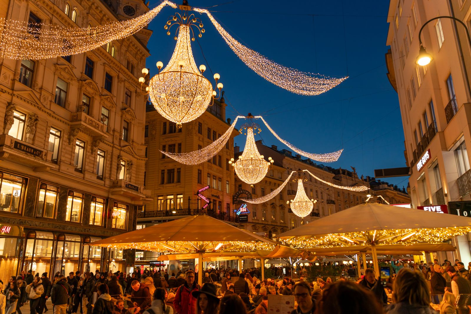 Giant chandeliers of light hanging above the Graben in Vienna at night