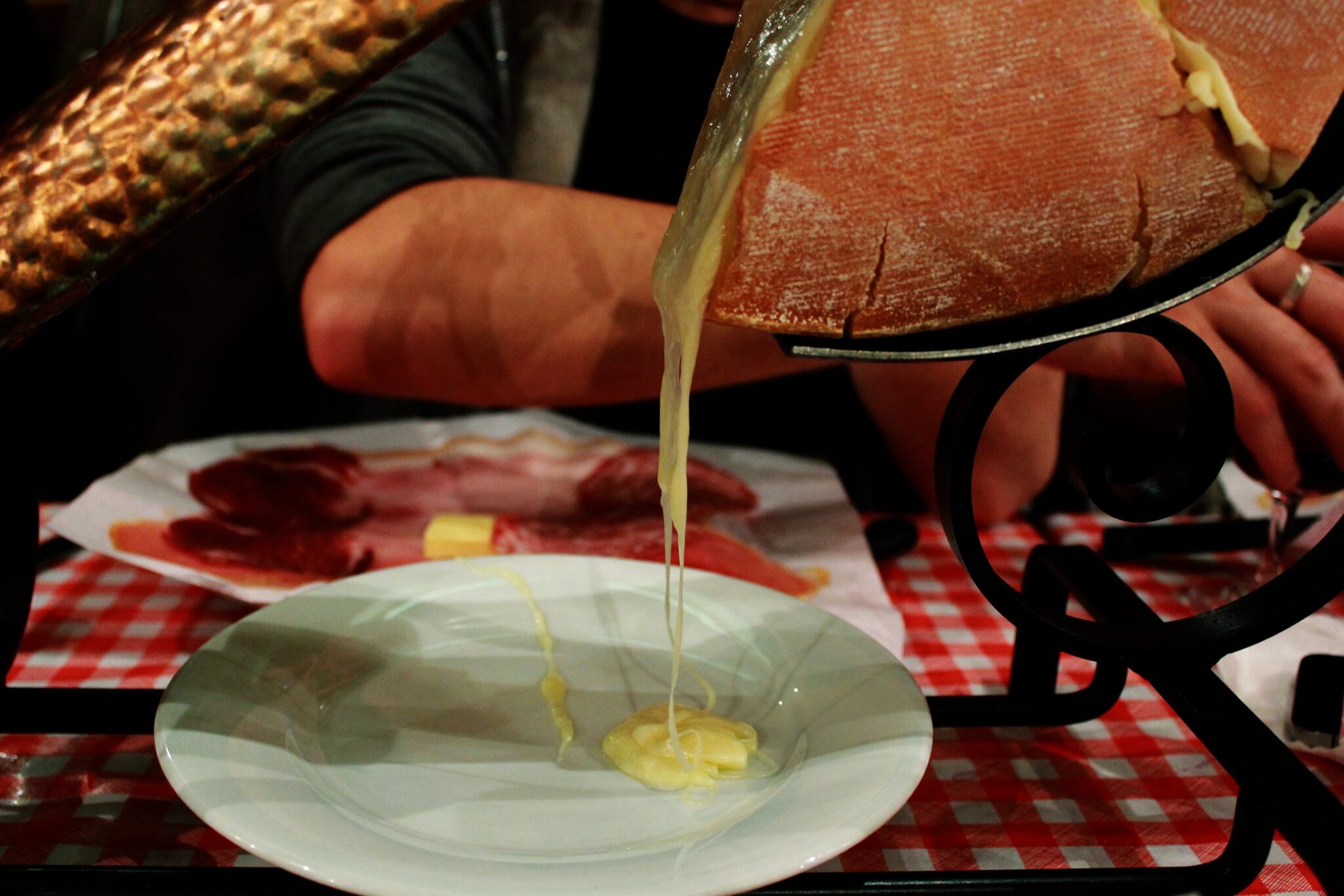 Raclette scraped molten over the plate