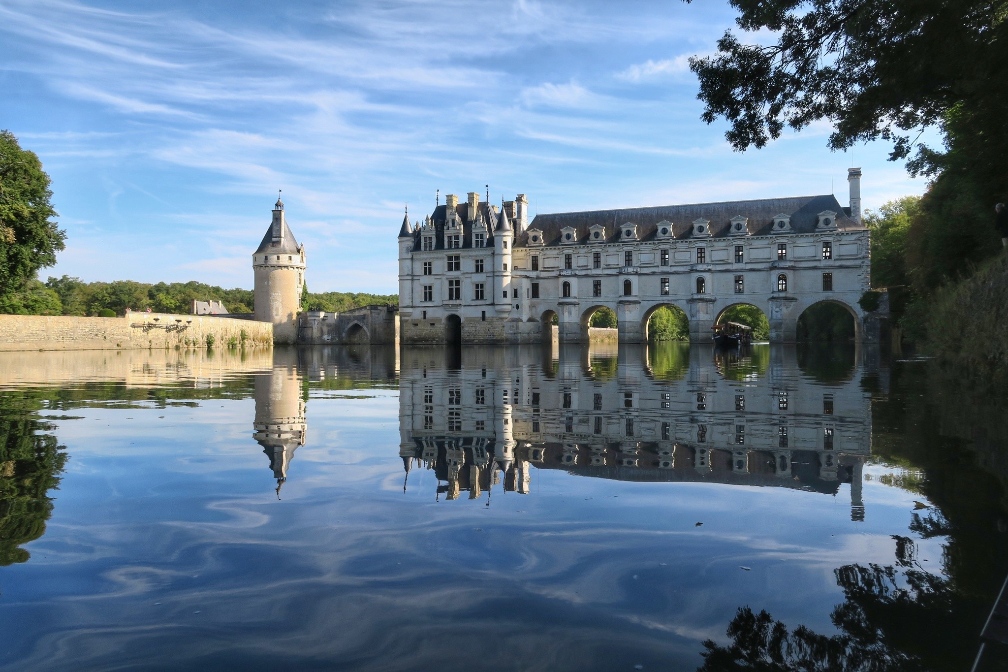 Château de Chenonceau spanning the River Cher, mirrored in the water