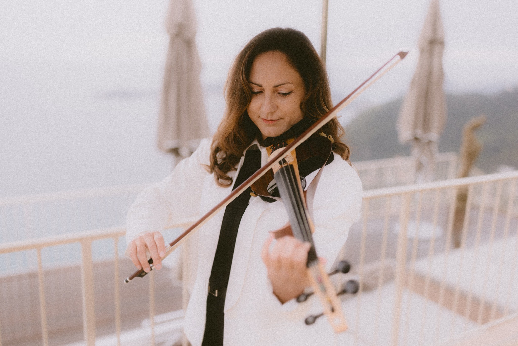 A violinist playing on the terrace above the Mediterranean at Èze