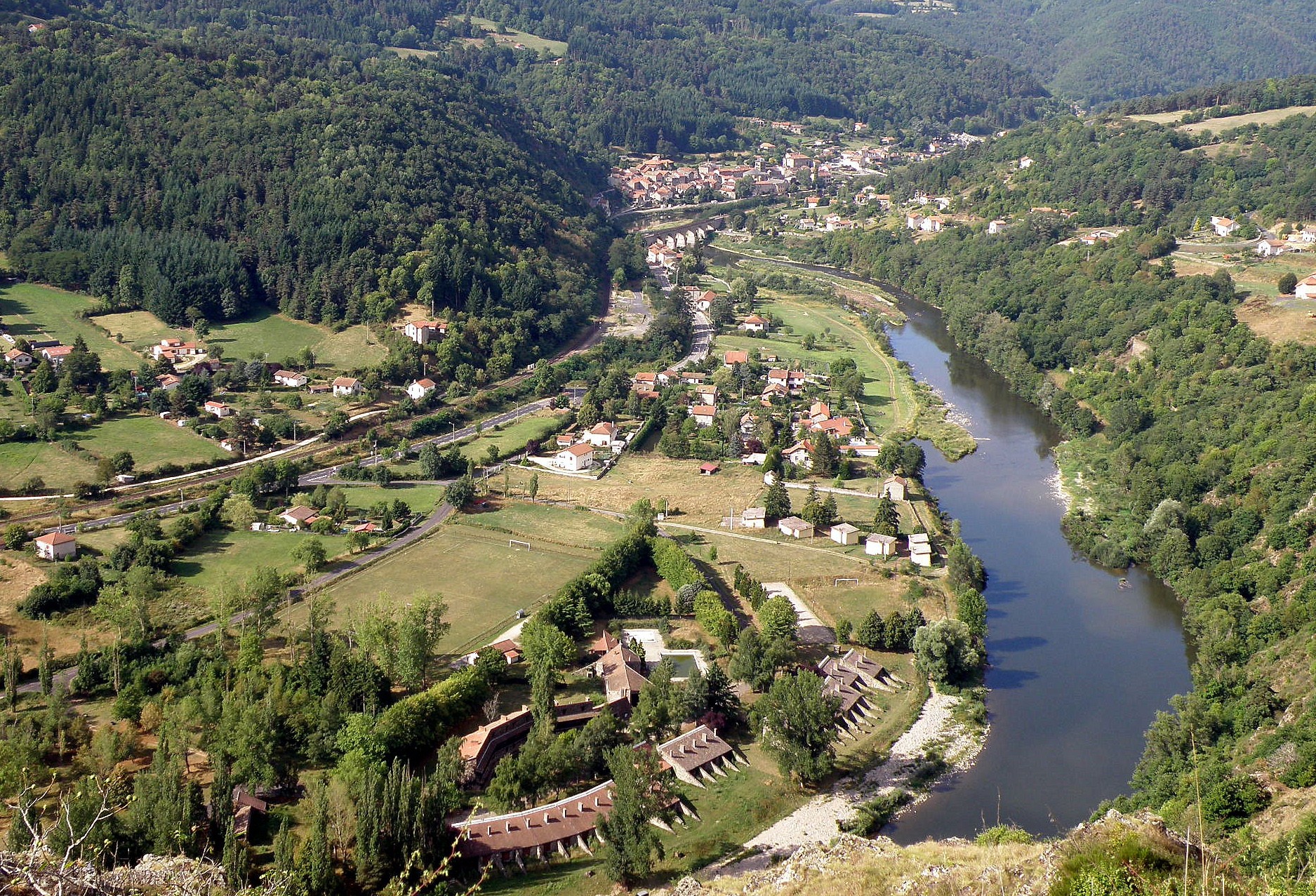 The Loire river at dusk below a village