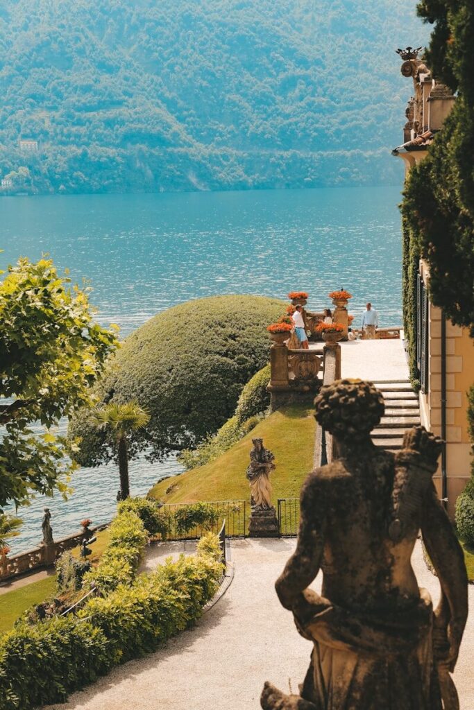 Amalfi Coast in Summer: The Right Hour from Capri to Ravello 4 a statue in front of a large body of water